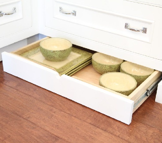 Pull-out trays built into the toe-kick